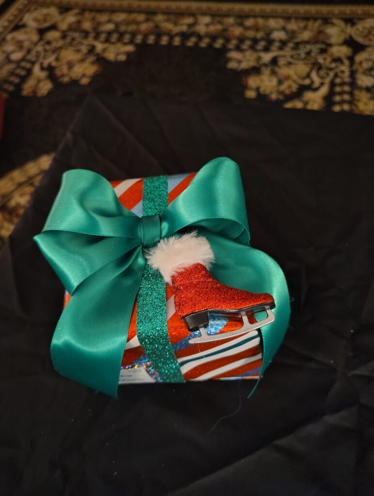 peppermint with blue stripe, green ribbon & red iceskate package