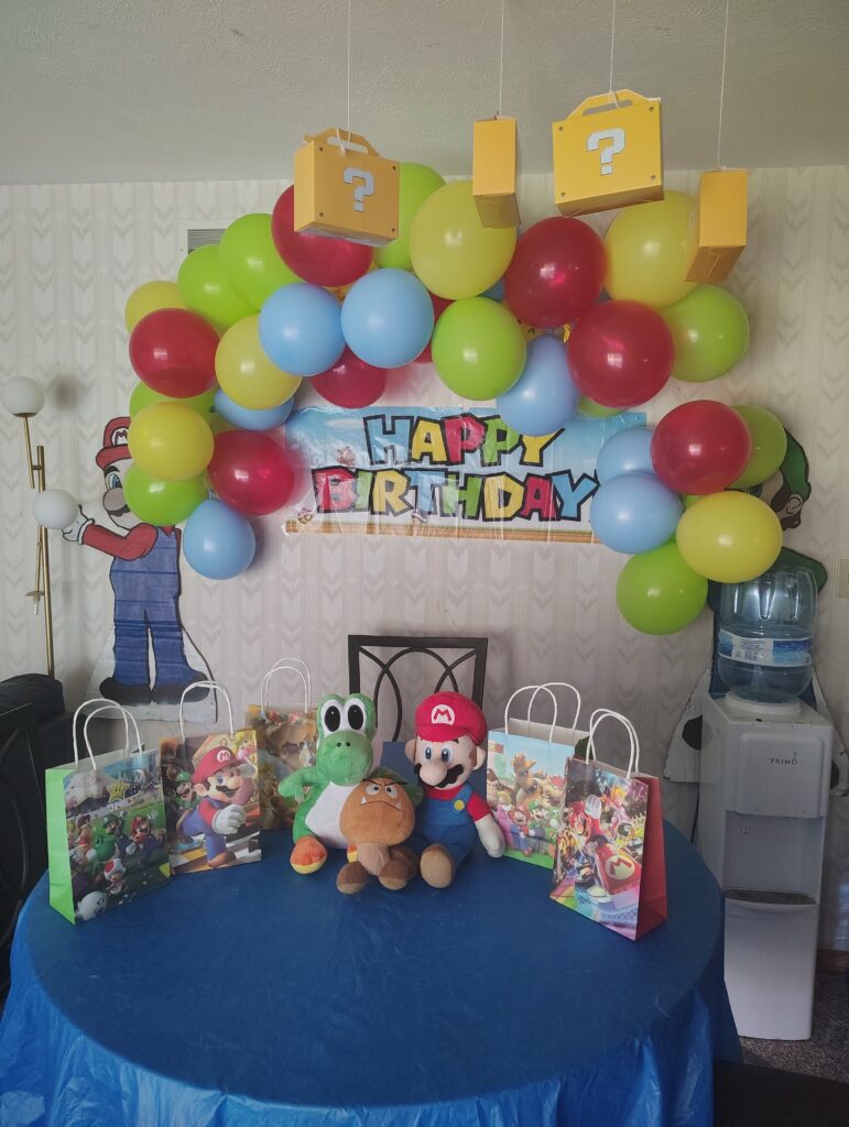 mario party setup with wall balloon garland3