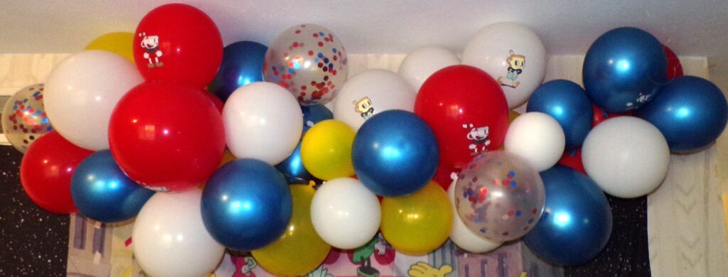 Cuphead white, blue, yellow, and red balloon arch